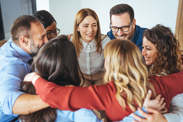 Obraz premium Diverse Team Embracing in a Circle to Show Support and Collaboration