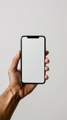 Male hand holding a smartphone with a white screen on a white background