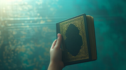 The Muslim holy Quran held in hand
