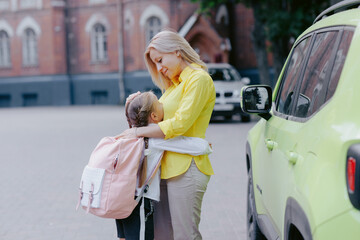 Emotional Hug Between Mother and Daughter Before School Drop Off on First Day Back to School