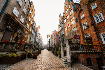 Gdansk with Motlawa river in Poland. Old town colourful house with church and Mariacka street