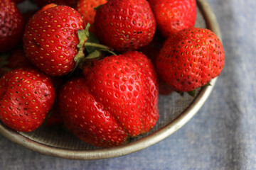 Strawberries in a sieve on a table