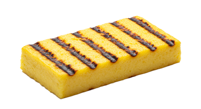 Close up of a grilled polenta block with dark grill marks on a black background studio shot on transparent background