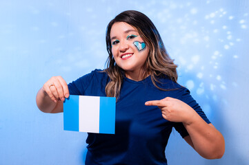Woman Proudly Showing and Pointing at Guatemalan Flag