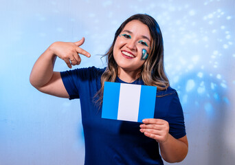 Smiling Guatemalan Fan Pointing at National Flag