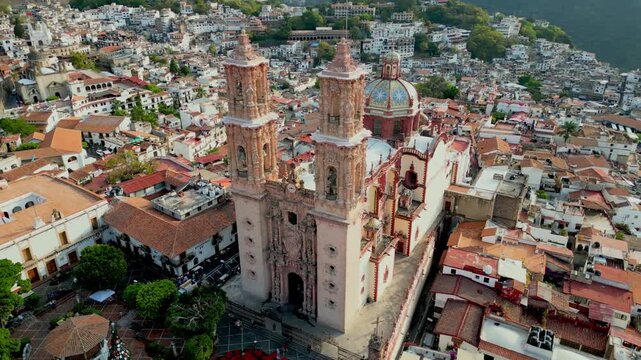 Aerial footage circling Santa Prisca Church in Taxco, Guerrero, showing town's colonial charm