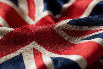 Closeup shot of a rumpled Union Jack flag showcasing its vibrant colors and detailed fabric texture