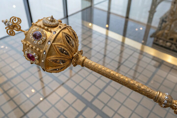 Golden scepter with jewels, royal regalia, monarchy symbol, coronation artifact, luxury item, treasure, antique
