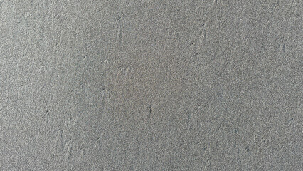 full frame photo of wet gray sand beach texture background © Nugrah