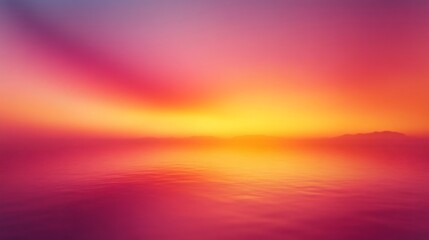Vibrant pink and orange sunset reflecting on calm ocean waters