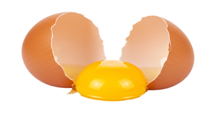 Close up of a cracked brown egg with a bright yellow yolk isolated on a black background on transparent background