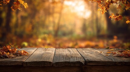 A wooden table with autumn leaves overlooks a blurry forest with trees in golden light