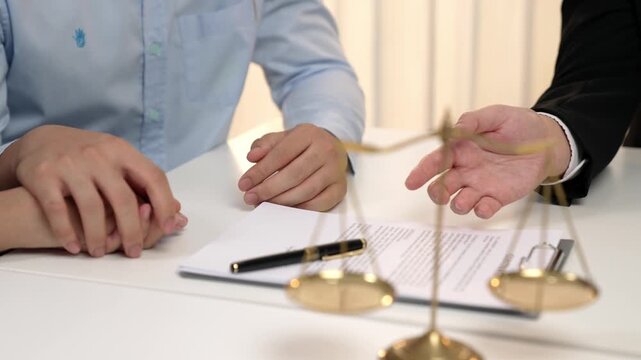 Loving couple seek legal consultation and assistance from law firm, discuss marriage law, proposal weddings and spousal support. Lawyer providing advice on marriage certification. Slow motion. Rigid.