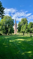Fredrikstad Cathedral in Norway Surrounded by Park and Green Lawn on a Summer Day