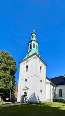 Obraz premium Historic Old Fredrikstad Church Exterior in Summer Light
