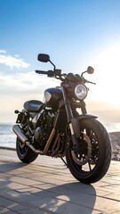 Naklejka premium Dark motorcycle on a paved seaside