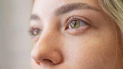 Fototapeta premium Close-up portrait of a woman after eyelash lamination procedure. 
