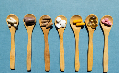 taking pills vitamins or supplements conceptual image