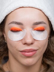 Caucasian woman undergoing eyelash lamination procedure. top view. 