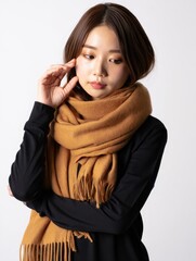 Young Woman Wrapped in Warm Brown Scarf, Studio Portrait