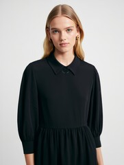 Young Woman in Black Dress Studio Portrait