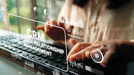 Business professional typing on keyboard with CRM concept displayed in digital graphics and background environment. Asymptotic smart data analytic. - Powered by Adobe