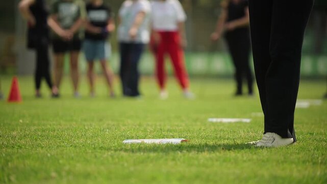 Golf practice session on a sunny day with beginners learning the basics of the game