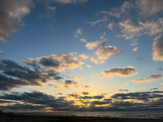 sunset over beaming sunset on Lake Michigan shore