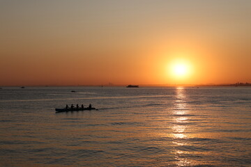 Beautiful sunset view. Amazing sea landscape. Burning sky and shining golden waves.