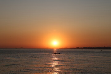 Beautiful sunset view. Amazing sea landscape. Burning sky and shining golden waves.