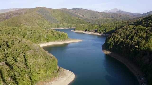 Aerial view of the Irabia lake and its surrounding forests in the Selva de Irati, Navarra, Spain.