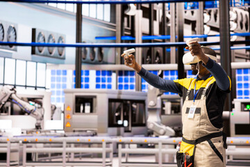 African American engineer with VR headset exploring industrial automation in smart manufacturing...
