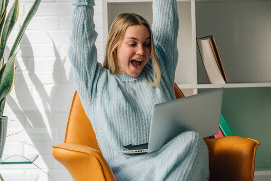 young woman or student at home with laptop, successful