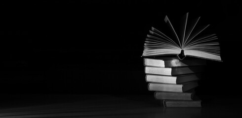 open book and stack of books,reading, education, knowledge is power concept.