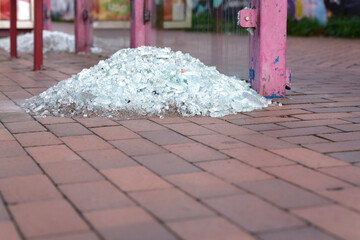 Shattered Glass Pile on Urban Pavement
