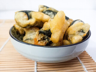 Gimmari,korean street food, made from fried noodle,carrot,mushroom and selected ingredients wrapped with seaweed or nori. Crunchy outside,soft inside. 