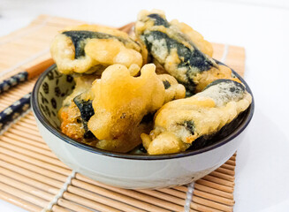 Gimmari,korean street food, made from fried noodle,carrot,mushroom and selected ingredients wrapped with seaweed or nori. Crunchy outside,soft inside. 