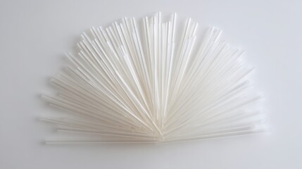Radial Arrangement of Thin Clear Plastic Straws Fanned Out Display