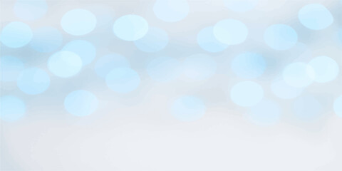 Gentle bokeh blur background in light blue hues with dreamy abstract glowing circles