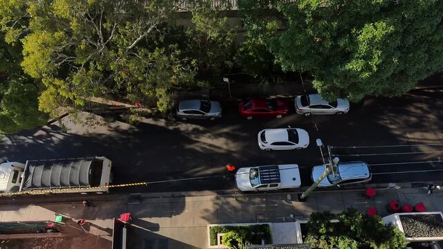 Timelapse of a busy neighborhood street with cars passing by