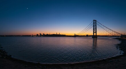 Fototapeta premium a large body of water with a bridge in the background