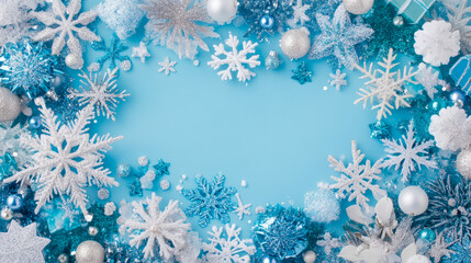 Elegant frosty winter wonderland border design featuring glittery silver, white, and blue snowflake ornaments and baubles on a light blue backdrop with copy space