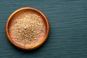 Bowl with amaranth pops - Amaranthus. Green background