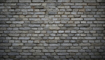 Close-up of weathered grey brick wall texture. This old facade shows rough block pattern with mortar lines, perfect for backgrounds, architectural designs. Offers rustic, vintage feel with copy space.