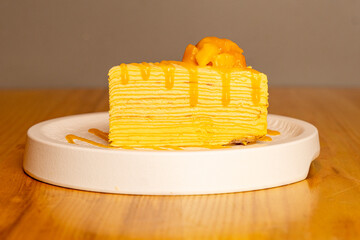 Slice of mango crepe cake