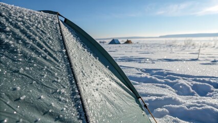 Morning Dew on Tent at Frozen Landscape in Winter Sunrise
