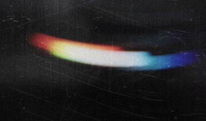 Blur colorful warm rainbow crystal light leaks on black background. Defocused abstract retro film analog effect for using over photos as overlay or screen filter