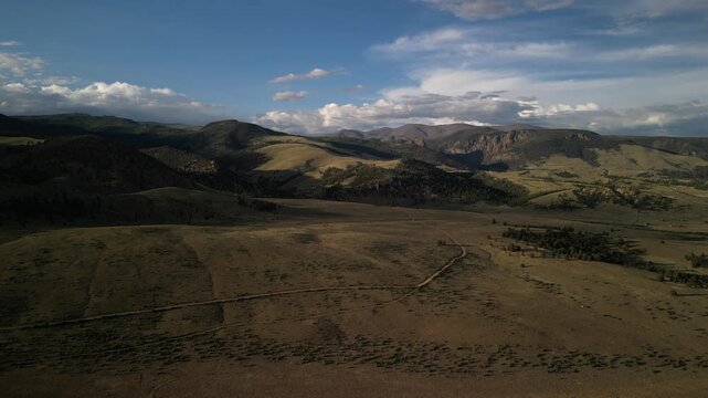 Wide aerial over La Garita mountains in Creede Colorado at sunset in Rio Grande National Forest