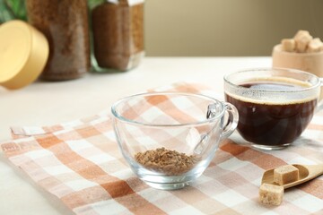 Aromatic instant coffee with sugar on table, closeup