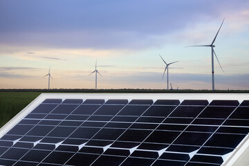 Solar panel and wind turbines outdoors. Alternative energy source